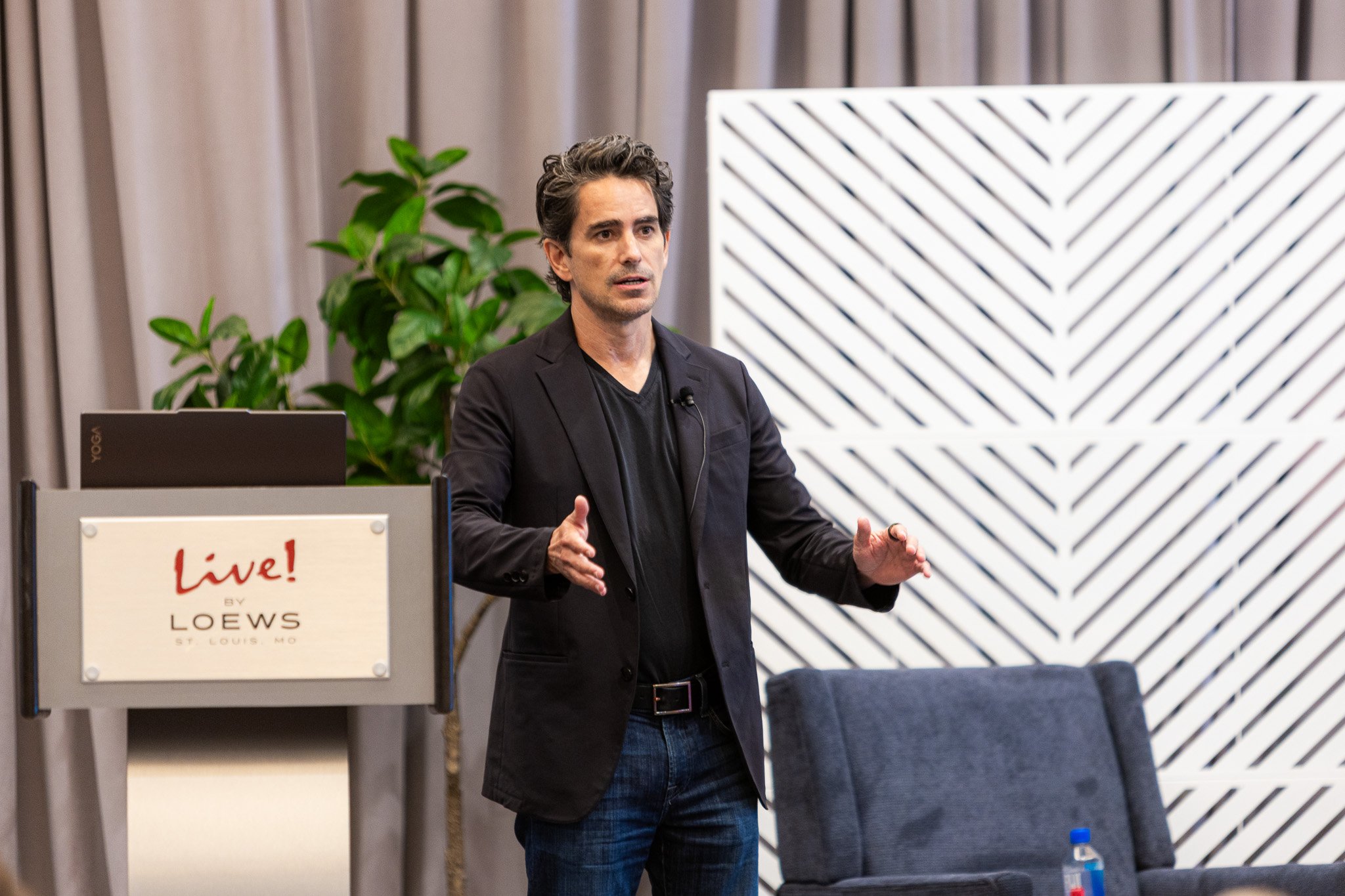 Walker Deibel speaking at Acquire It Summit