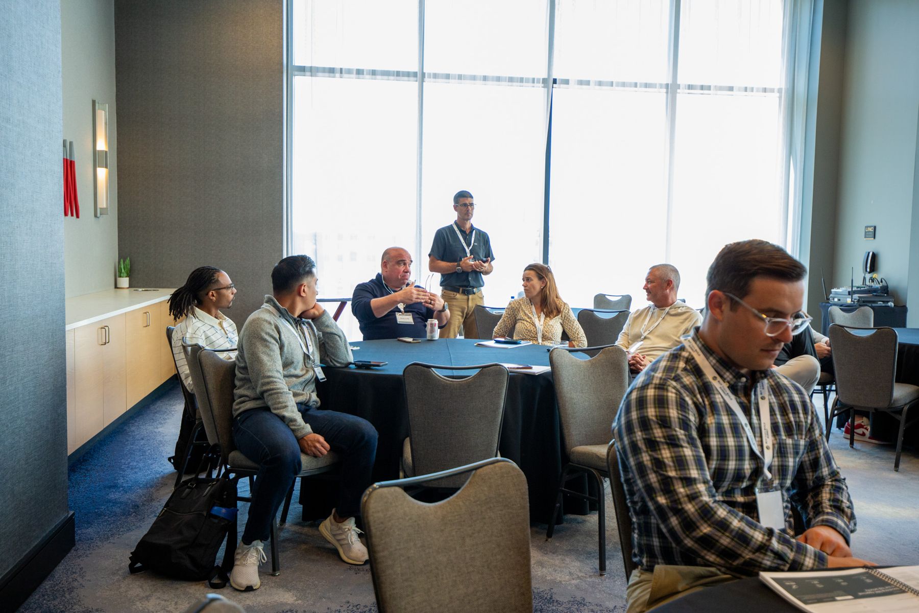 Members around a table at a Lab roundtable